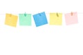 Colored yellow, green, blue, red stickers with paper clips hanging on a rope Royalty Free Stock Photo