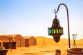 Coloreful berber lamp with traditional nomad tents on background
