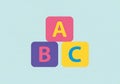 Colorful abc blocks stacked on a light blue background Royalty Free Stock Photo
