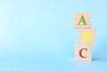 Colorful ABC letters on wooden blocks in blue background with copy space. Start of child or kid learning alphabet concept. Royalty Free Stock Photo