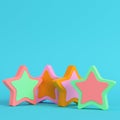 Colorful abstarct stars on bright blue background in pastel colors. Minimalism concept