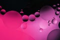 Colorful abstract background. Pink neon purple circles and oil bubbles in the water. Close up. Macro abstraction. Rainbow oil Royalty Free Stock Photo