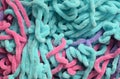 Colorful abstract background with plush yarn, pink, purple, green threads, soft feeling, hobby related background Royalty Free Stock Photo