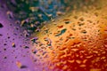 Colorful abstract background of purple, blue, red and orange beads of water. Royalty Free Stock Photo