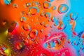 Colorful abstract background. Water drops colors on glass. Amazing abstract water drops on glass texture or background. Blue, red Royalty Free Stock Photo