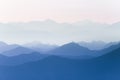 Colorful, abstract double exposure of mountains in sunrise. Minimalist scenery with color gradients.
