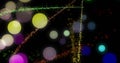 Colorful abstract lights and particles create vibrant, dynamic visual display