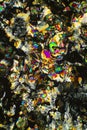 Colorful abstract micrograph of histidine crystals, with polarization