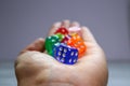 Colorful acrylic dice in the palm of your hand Royalty Free Stock Photo