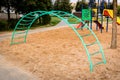 Colorful activities playground on the sand in the park. The concept of childhood of the urban area Royalty Free Stock Photo