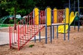 Colorful activities playground on the sand in the park. The concept of childhood of the urban area Royalty Free Stock Photo