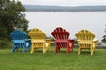 Colorful Adirondack chairs looking out on the lake