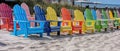 Colorful Adirondack chairs in a row