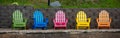 Colorful adirondack chairs on a Wisconsin lake deck Royalty Free Stock Photo