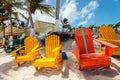 Colorful adirondack lounge chairs at Caribbean beach