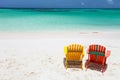 Colorful adirondack lounge chairs at Caribbean beach