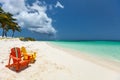 Colorful adirondack lounge chairs at Caribbean beach