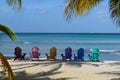 Colorful Adirondak Chairs on Palm Beach in Aruba Royalty Free Stock Photo