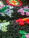 Colorful afghan Comforter with multiple color threads Royalty Free Stock Photo