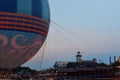 Colorful air balloon, pier and boathouse restaurant. Sunset Card in Disney Spring, Lake Buena Vista.