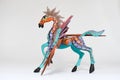 Colorful alebrije. Mexican hand painted wooden handicraft in the shape of a horse with wings. Royalty Free Stock Photo