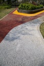 Colorful alley with carpet and plant bed in the park Royalty Free Stock Photo