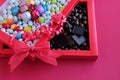 Colorful Almond Candies and Madlen Chocolate in red color carton box with red bow and ribbon.Unedit,original,as taken conceptual Royalty Free Stock Photo