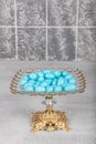 Colorful almond candies in the stylish, crystal candy bowl, almond sweets. The Sugar Feast concept. (Turkish name Ramadan -