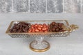 Colorful almond candies in the stylish, crystal candy bowl, almond sweets. The Sugar Feast concept. (Turkish name Ramadan -