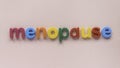 Colorful alphaber of word menopause on a pink background Royalty Free Stock Photo