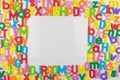 Colorful alphabet magnets on whiteboard framing copy space Royalty Free Stock Photo