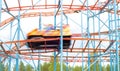 Colorful amusement park ride car going fast by with full speed. Royalty Free Stock Photo