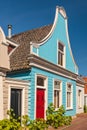 Colorful ancient blue wooden house in The Netherlands