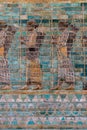 Colorful ancient Persian wall frieze in the Louvre museum in Paris