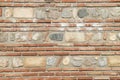 Colorful ancient stone wall closeup