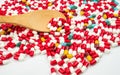 Colorful of antibiotic capsules pills and wood spoon Royalty Free Stock Photo