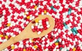 Colorful of antibiotic capsules pills and wood spoon Royalty Free Stock Photo