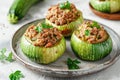 Colorful and appetizing stuffed zucchini rounds on a ceramic plate