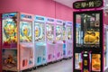 Colorful arcade game toy claw crane machine where people can win toys and other prizes