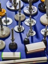 Various mechanical components displayed on a vibrant blue surface, showcasing multiple fasteners and mounts in different shapes Royalty Free Stock Photo
