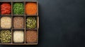 Colorful Arrangement of Spices and Seeds in Decorative Box on Dark Background Royalty Free Stock Photo