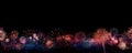 A colorful array of fireworks against a black sky, with the lower third of the image reserved for