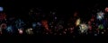 A colorful array of fireworks against a black sky, with the lower third of the image reserved for