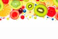 Colorful array of juicy kiwi, citrus, and berries bursting against a white background