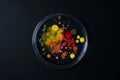 colorful array of microbial colonies in a Petri dish, where each cluster represents different bacteria growing in a Royalty Free Stock Photo