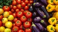 A colorful array of peppers eggplants and tomatoes on display