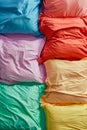 A colorful array of pillows with different shades of pink, green, yellow Royalty Free Stock Photo