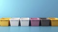 A Colorful Array of Plastic Storage Bins in Various Shades for Organizational Use Against a Vibrant Blue Background Royalty Free Stock Photo