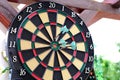 Colorful arrows hit the dartboard, hit right on target, electronic scoreboard counts the players` points, the concept of sports Royalty Free Stock Photo