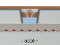 Colorful Art Deco feature on a building exterior